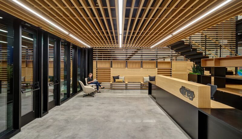 Inside Kreg tool reception facility area with wood beams and black desks